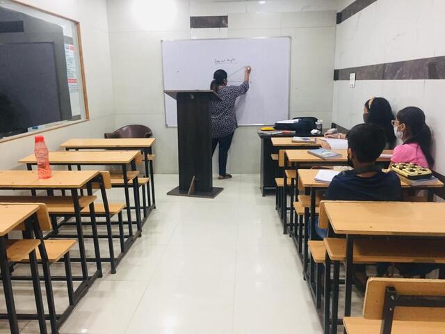 a teacher studying in class